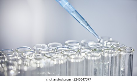 Science, test tubes and syringe for research, experiment or project in chemistry laboratory. Glass vials, innovation and chemical liquid for scientific innovation or analysis in a pharmaceutical lab. - Shutterstock ID 2245647397