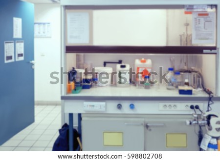 Scientific background: blurred interior of laboratory fume hood in modern laboratory. This is defocused background image, no focus point here. Can be used as a background for your presentation. 