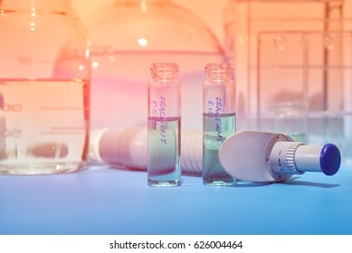 Scientific background. Tools for histopathology, fixative vials for biopsy tissue, rack of slide glasses in staining solution. This picture is toned, pace for your text.
