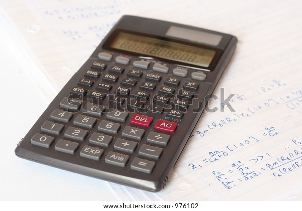 A scientific\
calculator over a maths\
sheet.