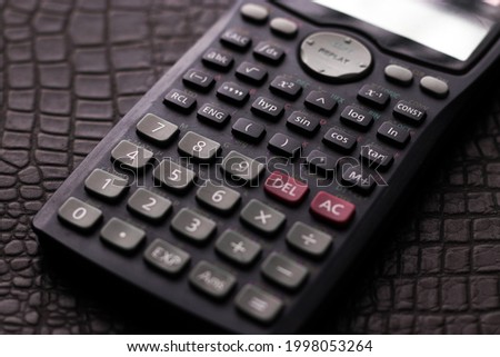 Scientific Calculator with a textured background stock image.