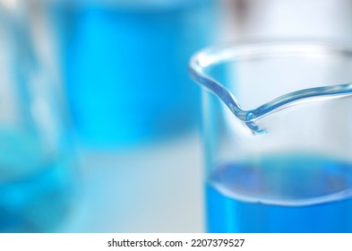 Scientific Laboratory Research And Experiments. Laboratory Test Tubes With Blue Liquid Close Up, Selective Focus.