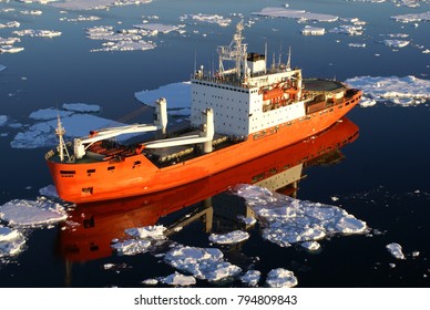 Scientific Research Vessel, Breaks Its Way In The Ice Of The Antarctic. View From Above.