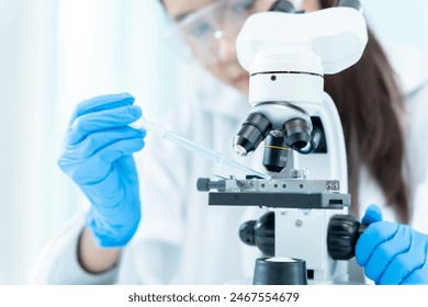 Scientist analyze biochemical samples in advanced scientific laboratory. Medical professional use microscope look microbiological developmental of viral. Biotechnology research in science lab.