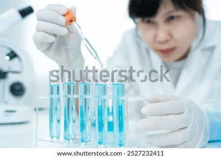 Scientist analyze biochemical samples in advanced scientific laboratory. Medical professional use dropper mix microbiological developmental of viral. Biotechnology research in  science lab. cosmetic