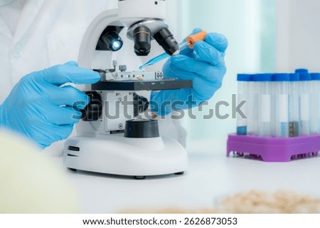 Scientist analyze biochemical samples in advanced scientific laboratory. Medical professional use microscope look microbiological developmental of viral. Biotechnology research in science lab.