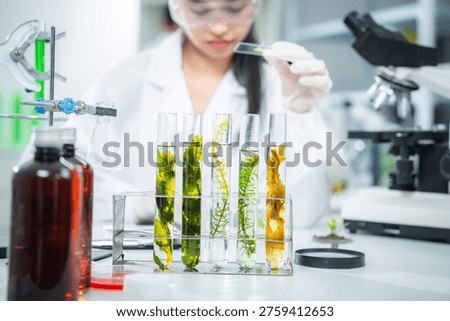 Scientist analyzing plant samples in modern laboratory, develop sustainable biotechnology solutions green energy, climate action, net zero innovation, supporting clean future and eco-friendly research
