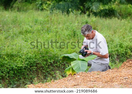 Scientist with camcoder studying plant desease