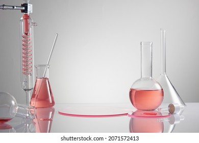 Scientist with chemical reaction in chemistry laboratory. close up of scientist making research in lab in white background , red water in test tube and blank space for advertising , front view - Powered by Shutterstock