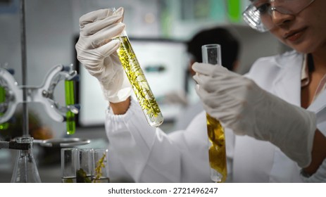 Scientist comparing algae samples in modern laboratory to study renewable bioenergy, biotechnology, and sustainable innovation, support eco-friendly solutions, clean power, and alternative energy.