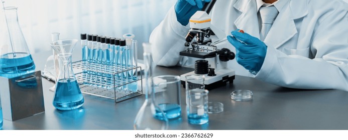 Scientist conduct chemical experiments and research in medical lab as groundbreaking developing for vaccine drug or antibiotic. Pharmaceutical and biochemistry laboratory. Neoteric - Powered by Shutterstock