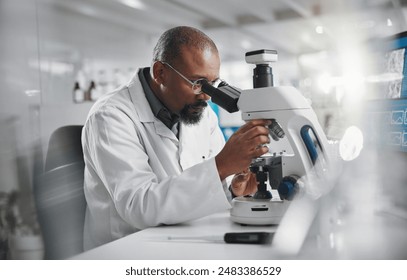 Scientist, development and microscope in laboratory for analysis, innovation and medical research. Black man, technology and professional person or expert in clinic for diagnosis, cure or health care