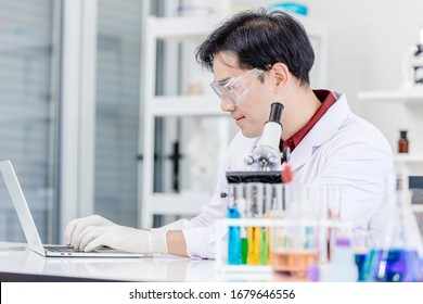 Scientist Doctor Or Medical Laboratory Technologist Working Online In Hospital Medicine Lab With Laptop Computer Happy Smile Face.