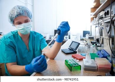 Scientist Doing DNA Test In Modern Laboratory