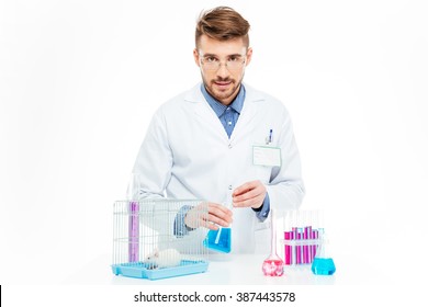 Scientist doing experiments with rat in a laboratory 