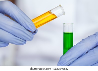 Scientist is Doing Her Research. Chemistry Experiment. Laborer Testing Face Cosmetic. Scientist Hold Test Tube With Liquid Inside in Laboratory.