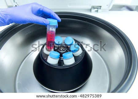 Scientist down cell in media using a high speed centrifuger