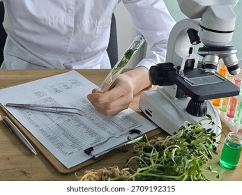 Scientist examines plant samples using a microscope in a research lab setting during daylight hours - Powered by Shutterstock - Get 15% off with code: PIKWIZARD15