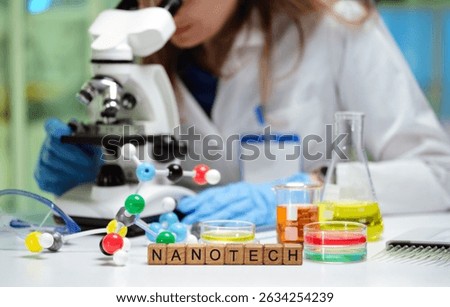 A scientist examines samples under a microscope in a nanotech lab, showcasing innovation in the field
