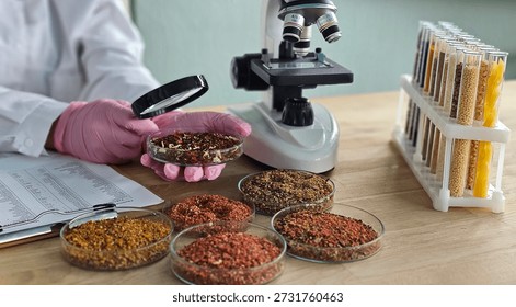 Scientist examines spices using a microscope in a laboratory setting during the day