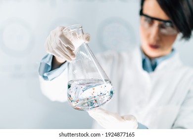 Scientist Examining Microplastic Particles In A Water Sample