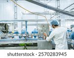 scientist food processing plant supervisor examines industrial control systems, overseeing the production line to maintain high-quality standards and optimize the automated manufacturing process.