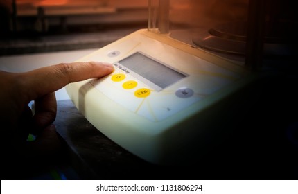 Scientist Hand With Electronic Weighing Scales (Laboratory Balance Or Microgram Weighing