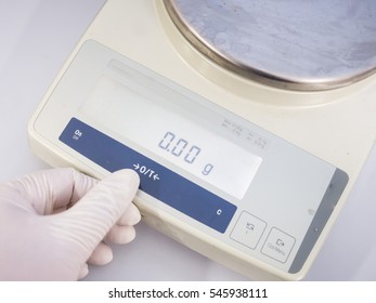 Scientist Hand With Electronic Weighing Scales (Laboratory Balance Or Microgram Weighing) 