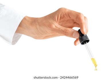 Scientist hand holding pipette dropper with drop of essential oil or serum isolated on white background.  - Powered by Shutterstock