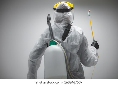 Scientist holding chemical sprayer for sterilization and decontamination of viruses, germs, pests, infectious diseases. - Shutterstock ID 1682467537