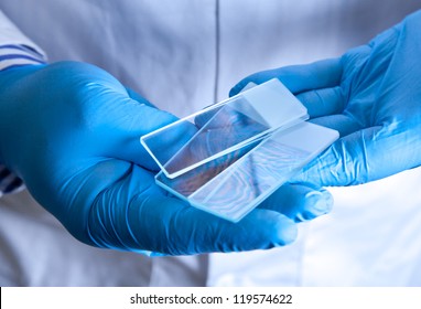 Scientist Holding Frosted Glass Microscope Slides