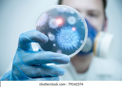 A Scientist Holding A Petri Dish With Virus And Bacteria Cells.