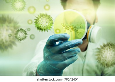 A scientist holding a Petri Dish with Virus and bacteria cells. - Powered by Shutterstock