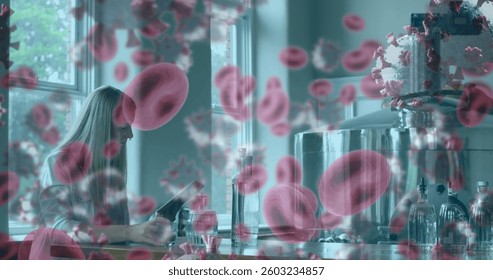 Scientist in laboratory analyzing data with digital overlay of blood cells. Research, biotechnology, innovation, microscopy, medical, technology