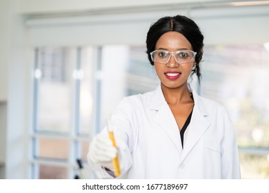 Scientist In Laboratory Holding A Test Tube. Medical Healthcare Technology And Pharmaceutical Research And Development Concept