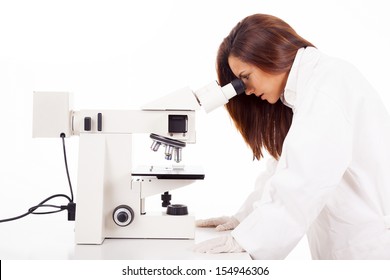 Scientist Looking Through Microscope A Sample Of Blood, Isolated On White Background