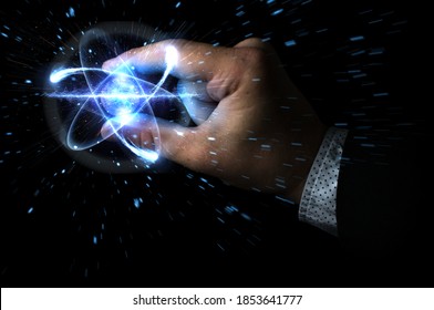 Scientist man holding atom particle between his fingers