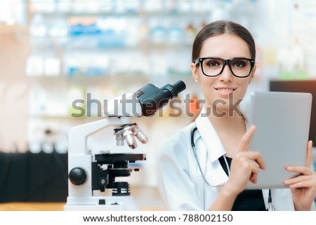 Scientist with Microscope and Pc Tablet doing Research Study. Research expect testing sample and checking medical studies
