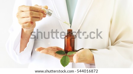 Scientist with natural drug research, Green herbal medicine discovery at science lab. (Selective Focus)