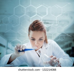 Scientist pouring liquid into erlenmeyer with futuristic screen showing formula behind her