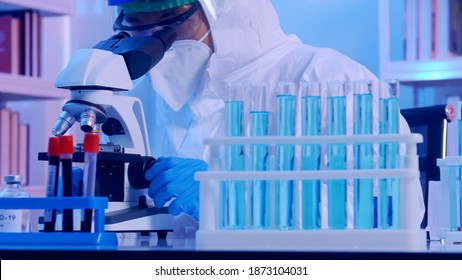 Scientist In PPE Suit Conducts Research On The COVID 19 Vaccine At A Laboratory.