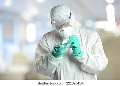 Scientist in protective Hazmat Suit working in laboratory