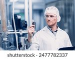 Scientist in Science Lab proudly invented New Medicine Formula. Medical factory staff happy smiling with Concentrate Medical Extract from Plant.