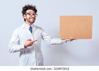 Scientist Showing And Pointing At A Blank Clipboard, Professor In White Coat Holding And Showing A Blank Clipboard Isolated. A Scientist In A White Coat Is Holding And Showing A Blank Clipboard