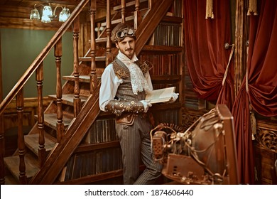 Scientist Steampunk Man Inventor Works In His Laboratory With Victorian Interior. Adventure World Of Steampunk.