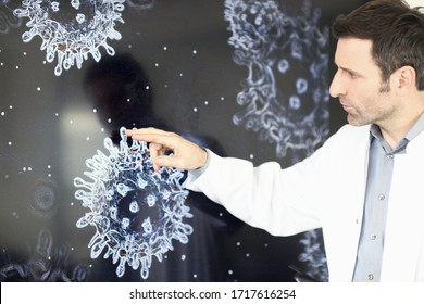 Scientist studying virus on screen - Shutterstock ID 1717616254