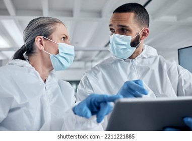 Scientist Team, Covid Research And Tablet With Doctors Discussing Medical Information, Analysis And Teamwork In Lab. Medical Man And Woman Using Technology And PPE For Safety, Health And Wellness