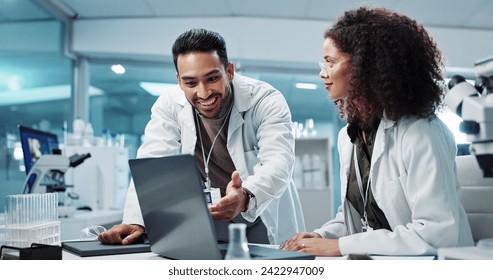 Scientist, teamwork and happy with laptop in laboratory for test breakthrough, pharmaceutical review or success. Science, collaboration or technology for research, discussion and digital analysis - Powered by Shutterstock