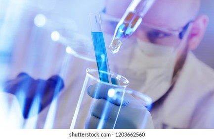 Scientist with test tubes
