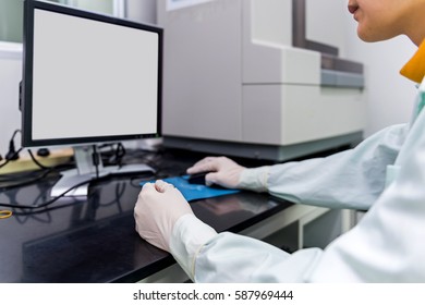 Scientist Using Computer In Medical Laboratory